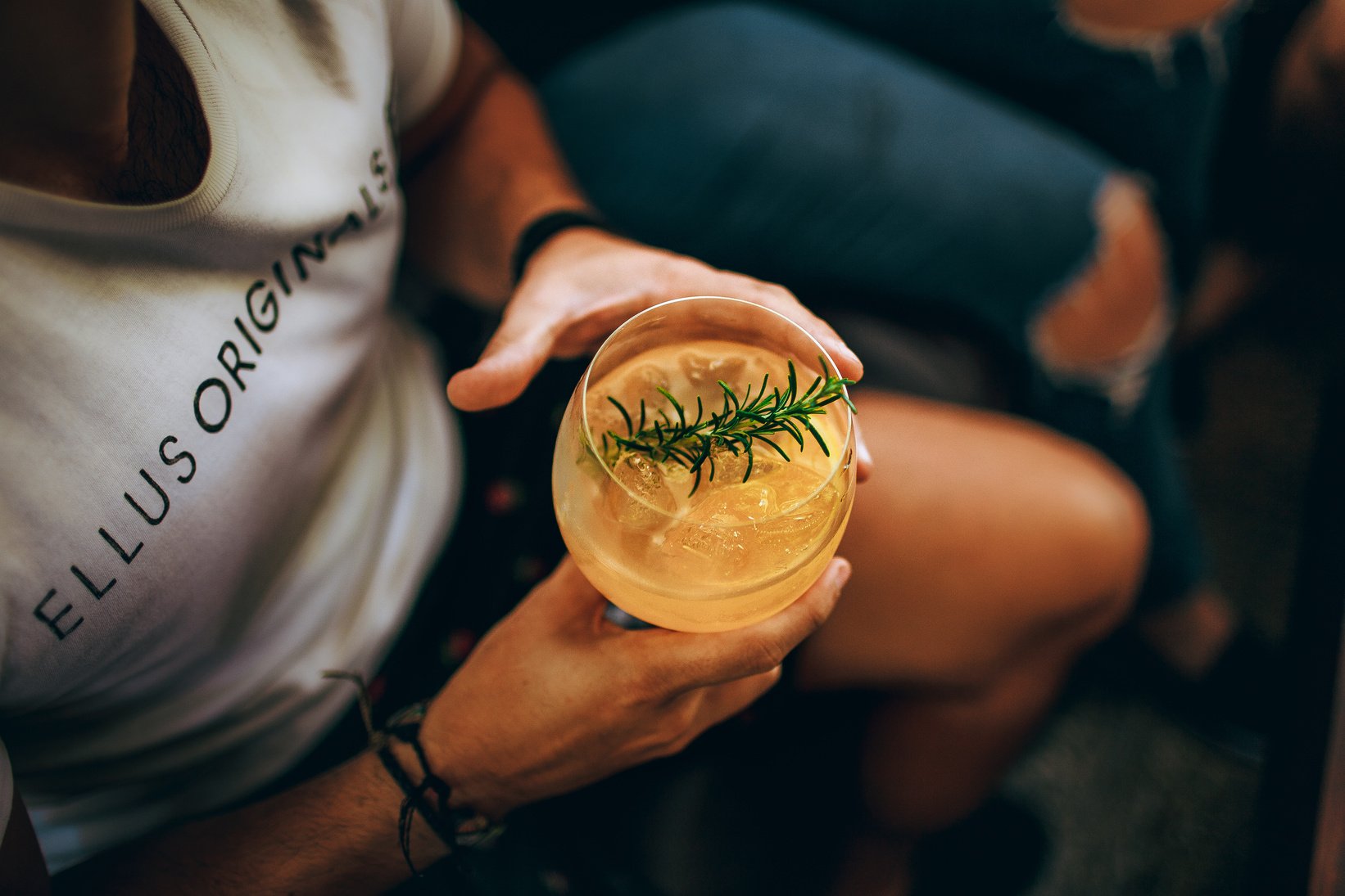 Crop man with glass of cocktail