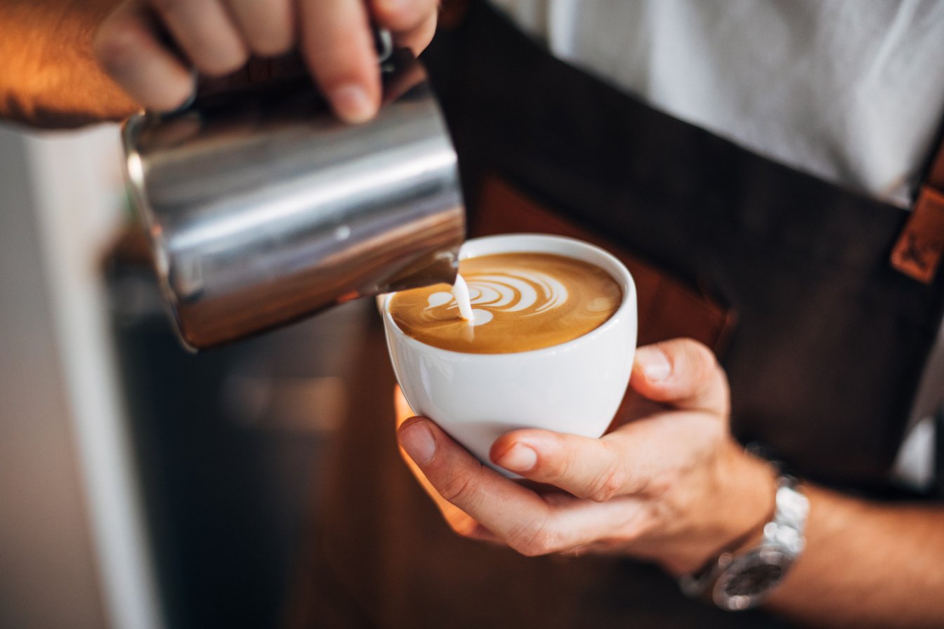 Barista pouring latte art